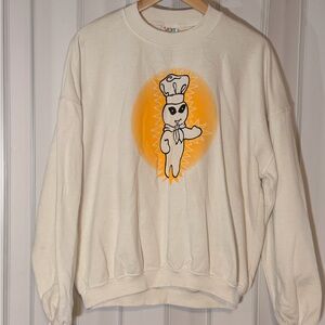 Cream graphic crewneck sweater with orange chef design